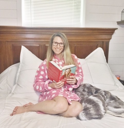 brittany in bed reading a book