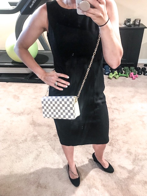 brittany wearing checkered crossbody bag